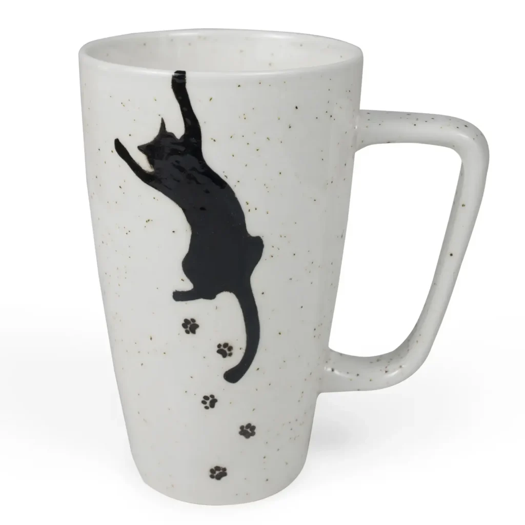 White speckled Kitty Cat mug with a black cat and paw prints.